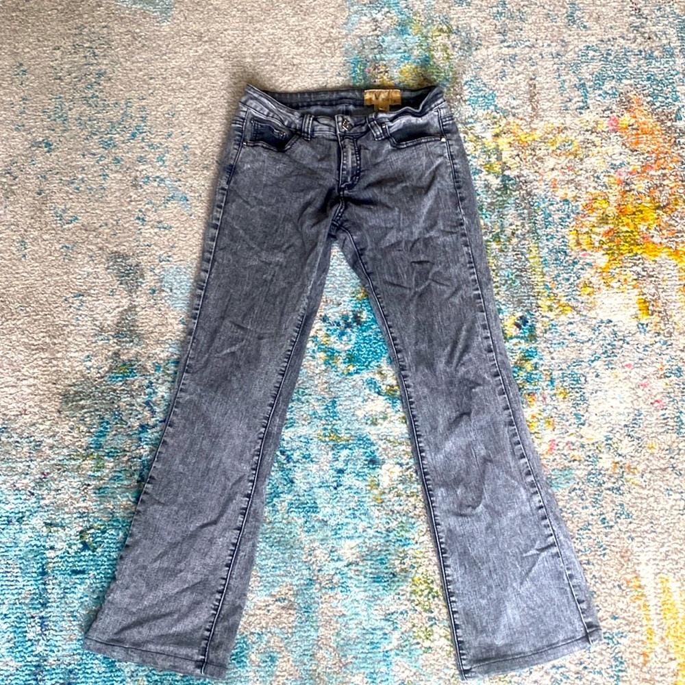 Black acid-washed jeans with flare legs.